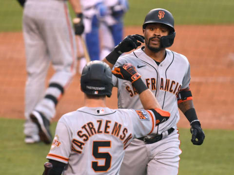 LOS ANGELES, CALIFORNIA – JULY 24: Jaylin Davis #49 of the SF Giants celebrates his solo home run with Mike Yastrzemski #5 to trail the Los Angeles Dodgers 2-1, during the second inning at Dodger Stadium on July 24, 2020, in Los Angeles, California. The 2020 regular season has been shortened to 60 games due to the COVID-19 Pandemic. (Photo by Harry How/Getty Images)