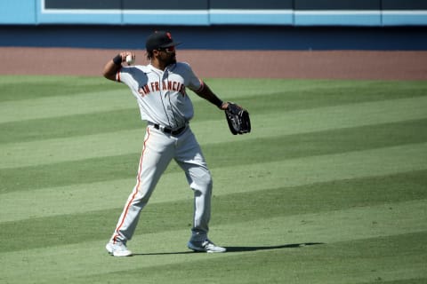 LOS ANGELES, CALIFORNIA – JULY 25: Jaylin Davis #49 of the SF Giants warms up in between innings against the Los Angeles Dodgers at Dodger Stadium on July 25, 2020. The 2020 season had been postponed since March due to the COVID-19 pandemic. (Photo by Katelyn Mulcahy/Getty Images)