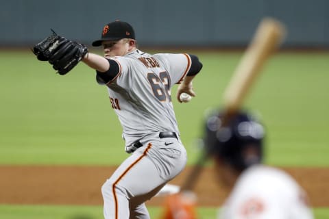 Logan Webb #62 of the SF Giants pitches in the second inning against the Houston Astros at Minute Maid Park on August 10, 2020. (Photo by Tim Warner/Getty Images)