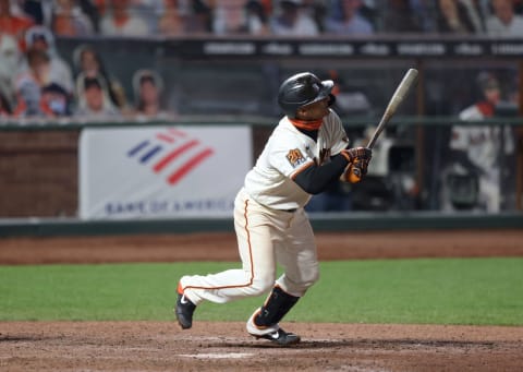 Donovan Solano #7 of the SF Giants hits a walk-off home run to win the game in the 11th inning against the Los Angeles Dodgers at Oracle Park on August 25, 2020 in San Francisco, California. (Photo by Ezra Shaw/Getty Images)