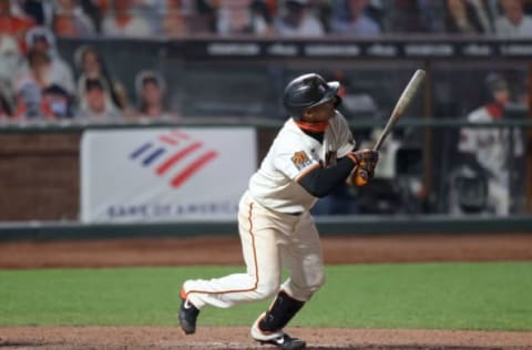 SAN FRANCISCO, CALIFORNIA – AUGUST 25: Donovan Solano #7 of the SF Giants hits a walk-off home run to win the game in the 11th inning against the Los Angeles Dodgers at Oracle Park on August 25, 2020, in San Francisco, California. (Photo by Ezra Shaw/Getty Images)