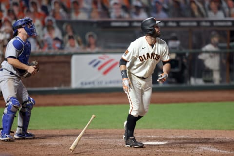 Brandon Belt #9 of the SF Giants hits a home run in the ninth inning to tie their game against the Los Angeles Dodgers at Oracle Park on August 25, 2020. (Photo by Ezra Shaw/Getty Images)