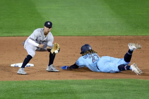 BUFFALO, NEW YORK – SEPTEMBER 07: Thairo Estrada #71 of the New York Yankees catches a ball thrown by Kyle Higashioka #66 of the New York Yankees as Vladimir Guerrero Jr. #27 of the Toronto Blue Jays slides safely into second base. The SF Giants acquired Estrada earlier this year. (COVID-19). (Photo by Bryan M. Bennett/Getty Images)