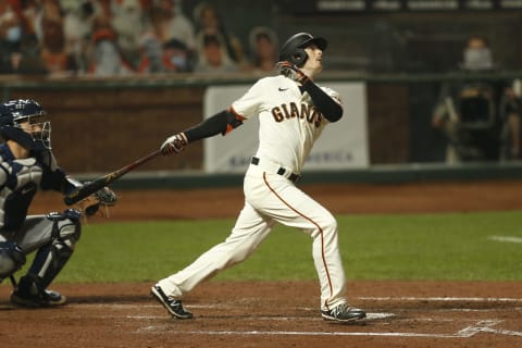 Mike Yastrzemski #5 of the SF Giants hits a three-run home run in the bottom of the third inning against the Seattle Mariners at Oracle Park. (Photo by Lachlan Cunningham/Getty Images)