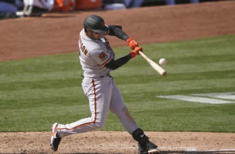 OAKLAND, CALIFORNIA – SEPTEMBER 19: Daniel Robertson #2 of the San Francisco Giants bats against the Oakland Athletics in the top of the seventh inning at RingCentral Coliseum on September 19, 2020 in Oakland, California. (Photo by Thearon W. Henderson/Getty Images)