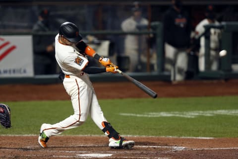 SAN FRANCISCO, CALIFORNIA – SEPTEMBER 23: Mauricio Dubón #1 of the SF Giants hits a three-run home run in the bottom of the fifth inning against the Colorado Rockies at Oracle Park on September 23, 2020. (Photo by Lachlan Cunningham/Getty Images)