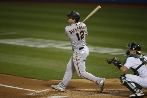 Alex Dickerson #12 of the SF Giants bats during the game against the Oakland Athletics at RingCentral Coliseum on September 18, 2020 in Oakland, California. (Photo by Michael Zagaris/Oakland Athletics/Getty Images)