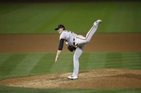 OAKLAND, CA – SEPTEMBER 18: Caleb Baragar #73 of the San Francisco Giants pitches during the game against the Oakland Athletics at RingCentral Coliseum on September 18, 2020 in Oakland, California. The Athletics defeated the Giants 6-0. (Photo by Michael Zagaris/Oakland Athletics/Getty Images)