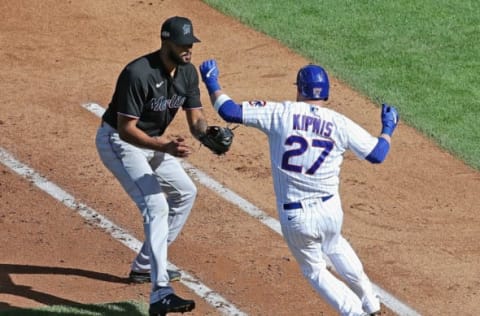 CHICAGO, ILLINOIS – SEPTEMBER 30: Sandy Alcantara #22 of the Miami Marlins readies to tag Jason Kipnis #27 of the Chicago Cubsin the first base line in the 5th inning during Game One of the National League Wild Card Series at Wrigley Field on September 30, 2020 in Chicago, Illinois. (Photo by Jonathan Daniel/Getty Images)