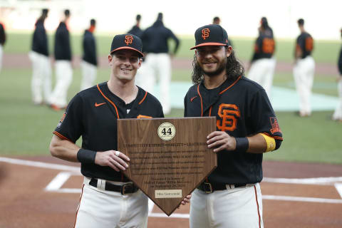 SAN FRANCISCO, CALIFORNIA – SEPTEMBER 26: Mike Yastrzemski #5 of the SF Giants is presented with the 2020 Willie Mac Award by teammate Brandon Crawford #35 before the game against the San Diego Padres at Oracle Park on September 26, 2020TT. (Photo by Lachlan Cunningham/Getty Images)