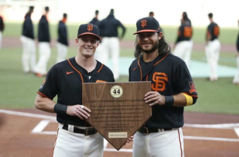 SAN FRANCISCO, CALIFORNIA – SEPTEMBER 26: Mike Yastrzemski #5 of the SF Giants is presented with the 2020 Willie Mac Award by teammate Brandon Crawford #35 before the game against the San Diego Padres at Oracle Park on September 26, 2020 in San Francisco, California. (Photo by Lachlan Cunningham/Getty Images)