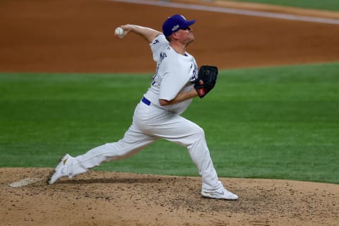 ARLINGTON, TEXAS – OCTOBER 13: Jake McGee #41 of the Los Angeles Dodgers delivers the pitch against Atlanta in Game Two of the National League Championship Series at Globe Life Field on October 13, 2020, in Arlington, Texas. (Photo by Ronald Martinez/Getty Images)