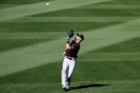 Outfielder Hunter Bishop #95 of the SF Giants catches a fly-ball against the Texas Rangers during the fourth inning of the MLB spring training game on March 01, 2021. (Photo by Christian Petersen/Getty Images)