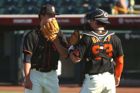 SCOTTSDALE, ARIZONA – MARCH 28: Kai-Wei Teng #82 and Patrick Bailey #93 of the SF Giants have a conversation after getting into a jam in the ninth inning against the Oakland Athletics in an MLB spring training game at Scottsdale Stadium. (Photo by Abbie Parr/Getty Images)