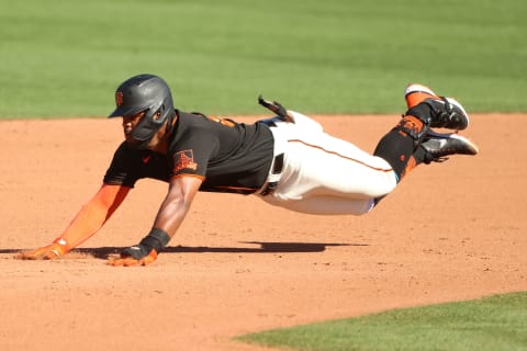 SCOTTSDALE, ARIZONA – MARCH 28: Heliot Ramos #80 of the SF Giants dives safely into second base in the eighth inning against the Oakland Athletics during the MLB spring training game at Scottsdale Stadium on March 28, 2021. (Photo by Abbie Parr/Getty Images)