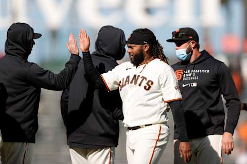 SAN FRANCISCO, CALIFORNIA – APRIL 09: Johnny Cueto #47 of the SF Giants is congratulated by teammates after they beat the Colorado Rockies in the Giants home opener at Oracle Park on April 09, 2021 in San Francisco, California. (Photo by Ezra Shaw/Getty Images)