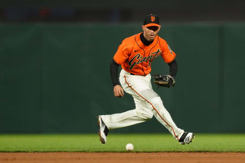 SAN FRANCISCO, CALIFORNIA – APRIL 23: Tommy La Stella #18 of the SF Giants fields a ball during the game against the Miami Marlins at Oracle Park on April 23, 2021. (Photo by Daniel Shirey/Getty Images)