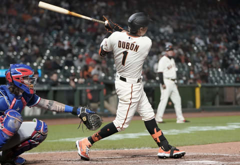 SAN FRANCISCO, CALIFORNIA – MAY 10: Mauricio Dubon #1 of the San Francisco Giants hits a pinch hit rbi single scoring Austin Slater #13 against the Texas Rangers in the seventh inning at Oracle Park on May 10, 2021 in San Francisco, California. (Photo by Thearon W. Henderson/Getty Images)