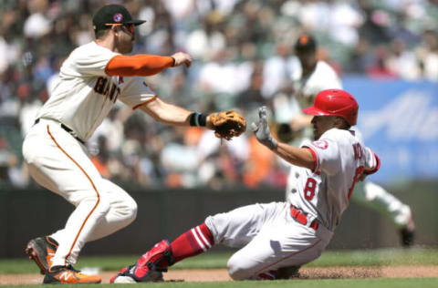 SAN FRANCISCO, CALIFORNIA – MAY 31: Kean Wong #8 of the Los Angeles Angels slides into third base with a triple past Evan Longoria #10 of the San Francisco Giants in the top of the fifth inning at Oracle Park on May 31, 2021 in San Francisco, California. (Photo by Thearon W. Henderson/Getty Images)