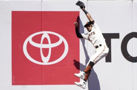 SAN FRANCISCO, CALIFORNIA – JULY 05: Thairo Estrada #39 of the San Francisco Giants makes a leaping catch at the wall taking a hit away from Nolan Arenado #28 of the St. Louis Cardinals in the top of the first inning at Oracle Park on July 05, 2021 in San Francisco, California. (Photo by Thearon W. Henderson/Getty Images)