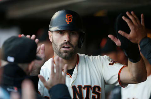 SAN FRANCISCO, CALIFORNIA – JULY 07: Curt Casali #2 of the San Francisco Giants celebrates in the dugout after scoring on a double by Mike Yastrzemski #5 in the bottom of the second inning against the St. Louis Cardinals at Oracle Park on July 07, 2021 in San Francisco, California. (Photo by Lachlan Cunningham/Getty Images)