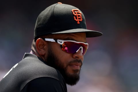 DENVER, COLORADO – JULY 11: Heliot Ramos #14 of the National League team watches from the dugout while playing the American League team during the MLB All-Star Futures Game at Coors Field on July 11, 2021. (Photo by Matthew Stockman/Getty Images)