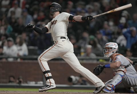 SAN FRANCISCO, CALIFORNIA – AUGUST 16: Kris Bryant #23 of the SF Giants swings and watches the flight of his ball as he hits a solo home run against the New York Mets in the bottom of the seventh inning at Oracle Park on August 16, 2021. (Photo by Thearon W. Henderson/Getty Images)