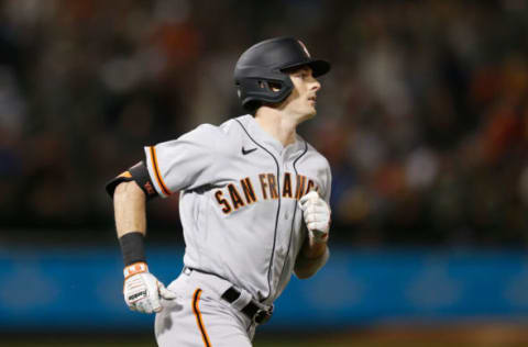 OAKLAND, CALIFORNIA – AUGUST 20: Mike Yastrzemski #5 of the San Francisco Giants rounds the bases after hitting a solo home run in the top of the fifth inning against the Oakland Athletics at RingCentral Coliseum on August 20, 2021 in Oakland, California. (Photo by Lachlan Cunningham/Getty Images)