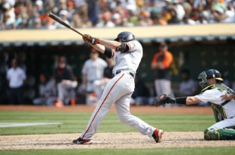 OAKLAND, CA – AUGUST 21: Darin Ruf #33 of the San Francisco Giants hits a home run during the game against the Oakland Athletics at RingCentral Coliseum on August 21, 2021 in Oakland, California. The Giants defeated the Athletics 6-5. (Photo by Michael Zagaris/Oakland Athletics/Getty Images)