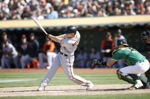 OAKLAND, CA – AUGUST 22: Alex Dickerson #12 of the San Francisco Giants bats during the game against the Oakland Athletics at RingCentral Coliseum on August 22, 2021 in Oakland, California. The Giants defeated the Athletics 2-1. (Photo by Michael Zagaris/Oakland Athletics/Getty Images)