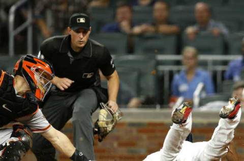 ATLANTA, GA – JUNE 22: Pinch runner Danny Santana #23 of the Atlanta Braves scores under the tag of catcher Nick Hundley #5 of the San Francisco Giants in the fifth inning while home plate umpire Quinn Wolcott #81 looks on during the game at SunTrust Park on June 22, 2017 in Atlanta, Georgia. (Photo by Mike Zarrilli/Getty Images)