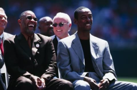 ST. LOUIS – APRIL 9: Former St. Louis Cardinals players Ozzie Smith and Willie McGee laugh during Willie McGee Day before the game against the Milwaukee Brewers at Busch Stadium on April 9, 2000 in St. Louis, Missouri. (Photo by Elsa/Getty Images)