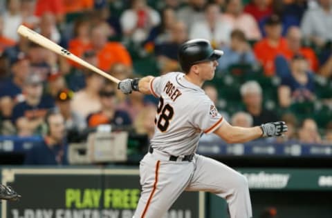 HOUSTON, TX – MAY 23: Buster Posey #28 of the San Francisco Giants doubles in the sixth inning against the Houston Astros at Minute Maid Park on May 23, 2018 in Houston, Texas. (Photo by Bob Levey/Getty Images)