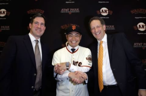 SAN FRANCISCO, CA – JANUARY 20: Norichika Aoki poses for a picture with Larry Baer, President and CEO of the San Francisco Giants and Bobby Evans (left), Vice President and Assistant General Manager of the San Francisco Giants during a press conference where he was introduced as the newest Giant at AT