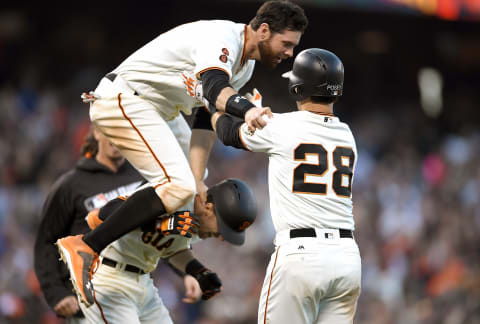 SAN FRANCISCO, CA – JUNE 11: Matt Duffy is being hurdled by Brandon Belt, which is just fine.