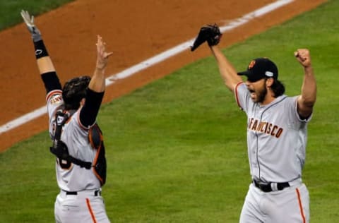 KANSAS CITY, MO – OCTOBER 29: Buster Posey #28 and Madison Bumgarner #40 of the San Francisco Giants celebrate after defeating the Kansas City Royals to win Game Seven of the 2014 World Series by a score of 3-2 at Kauffman Stadium on October 29, 2014 in Kansas City, Missouri. (Photo by Doug Pensinger/Getty Images)