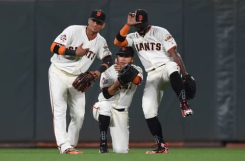 SAN FRANCISCO, CA – APRIL 24: (L-R) Gorkys Hernandez #7, Gregor Blanco #1 and Andrew McCutchen #22 of the San Francisco Giants celebrate a 4-3 win over the Washington Nationals at AT&T Park on April 24, 2018 in San Francisco, California. (Photo by Thearon W. Henderson/Getty Images)