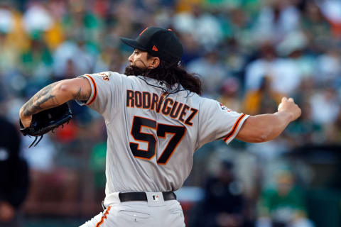 OAKLAND, CA – JULY 20: Dereck Rodriguez #57 of the San Francisco Giants pitches against the Oakland Athletics during the first inning at the Oakland Coliseum on July 20, 2018 in Oakland, California. (Photo by Jason O. Watson/Getty Images)