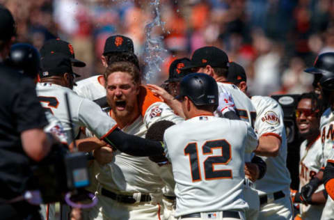 SAN FRANCISCO, CA – JUNE 24: Hunter Pence #8 of the San Francisco Giants is congratulated by teammates after hitting a two run walk off double against the San Diego Padres during the eleventh inning at AT&T Park on June 24, 2018 in San Francisco, California. The San Francisco Giants defeated the San Diego Padres 3-2 in 11 innings. (Photo by Jason O. Watson/Getty Images)