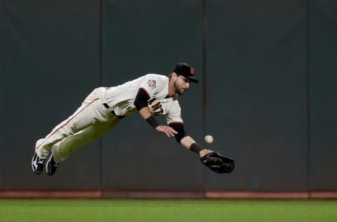 SAN FRANCISCO, CA – JULY 26: Steven Duggar #6 of the San Francisco Giants dives for the ball that goes for a triple off the bat of Brad Miller #10 of the Milwaukee Brewers in the top of the six inning at AT&T Park on July 26, 2018 in San Francisco, California. (Photo by Thearon W. Henderson/Getty Images)