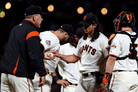 SAN FRANCISCO, CA – SEPTEMBER 10: Dereck Rodriguez #57 of the San Francisco Giants is relieved by manager Bruce Bochy #15 during the seventh inning against the Atlanta Braves at AT&T Park on September 10, 2018 in San Francisco, California. The Atlanta Braves defeated the San Francisco Giants 4-1. (Photo by Jason O. Watson/Getty Images)