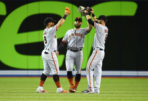 TORONTO, ON – APRIL 24: Gerardo Parra #8, Kevin Pillar #1 and Steven Duggar #6 of the San Francisco Giants congratulate each other following victory over the Toronto Blue Jays in a MLB game at Rogers Centre on April 24, 2019 in Toronto, Canada. (Photo by Vaughn Ridley/Getty Images)