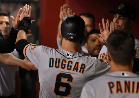 PHOENIX, ARIZONA – MAY 18: Steven Duggar #6 of the San Francisco Giants celebrates with teammates in the dugout after scoring on an RBI single by Buster Posey #28 during the third inning against the Arizona Diamondbacks at Chase Field on May 18, 2019 in Phoenix, Arizona. (Photo by Norm Hall/Getty Images)