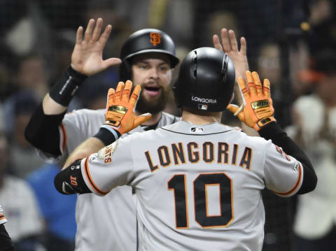 After another round of negative COVID-19 tests, the SF Giants and San Diego Padres have been cleared to return to action on Sunday. (Photo by Denis Poroy/Getty Images)