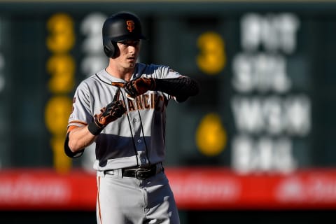 Mike Yastrzemski #5 of the SF Giants signals to the dugout after hitting an RBI double in the second inning against the Colorado Rockies at Coors Field on July 16, 2019. (Photo by Dustin Bradford/Getty Images)