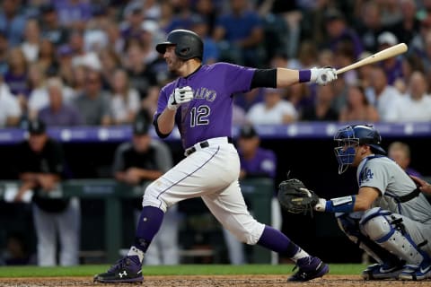 DENVER, COLORADO – JUNE 29: Mark Reynolds #12 of the Colorado Rockies hits a 2 RBI single in the sixth inning against the Los Angeles Dodgers at Coors Field on June 29, 2019 in Denver, Colorado. (Photo by Matthew Stockman/Getty Images)