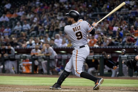 PHOENIX, ARIZONA – AUGUST 15: Brandon Belt #9 of the San Francisco Giants hits an RBI double in the sixth inning of the MLB game against the Arizona Diamondbacks at Chase Field on August 15, 2019 in Phoenix, Arizona. (Photo by Jennifer Stewart/Getty Images)