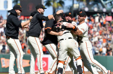 SAN FRANCISCO, CALIFORNIA – OCTOBER 03: The San Francisco Giants celebrate as they clinch NL West after their game against the San Diego Padres at Oracle Park on October 03, 2021 in San Francisco, California. (Photo by Brandon Vallance/Getty Images)