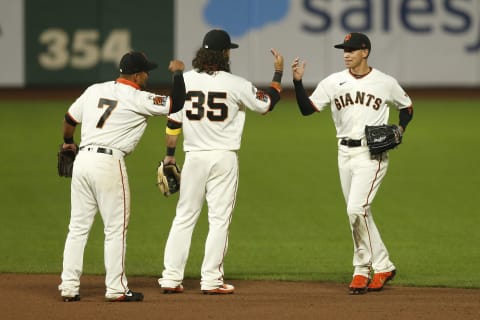 Donovan Solano #7, Brandon Crawford #35 and Mauricio Dubòn #1 of the SF Giants celebrate after a win against the Seattle Mariners at Oracle Park. (Photo by Lachlan Cunningham/Getty Images)tjacki