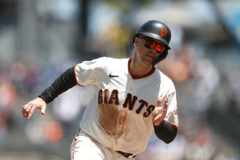 SAN FRANCISCO, CALIFORNIA – JUNE 06: Base runner Buster Posey #28 of the SF Giants rounds the bases to score on a double by Donovan Solano #7 in the bottom of the first inning against the Chicago Cubs at Oracle Park on June 06, 2021 in San Francisco, California. (Photo by Lachlan Cunningham/Getty Images)